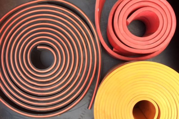 Different coloured Rolls of conveyor skirting rubbers